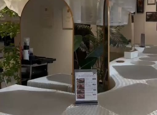 Arched mirrors and scalloped daybeds